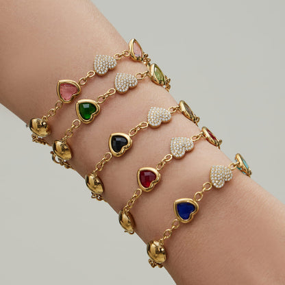 Close up of 316L stainless steel heart charm bracelet stack designed for wholesale jewelry supply