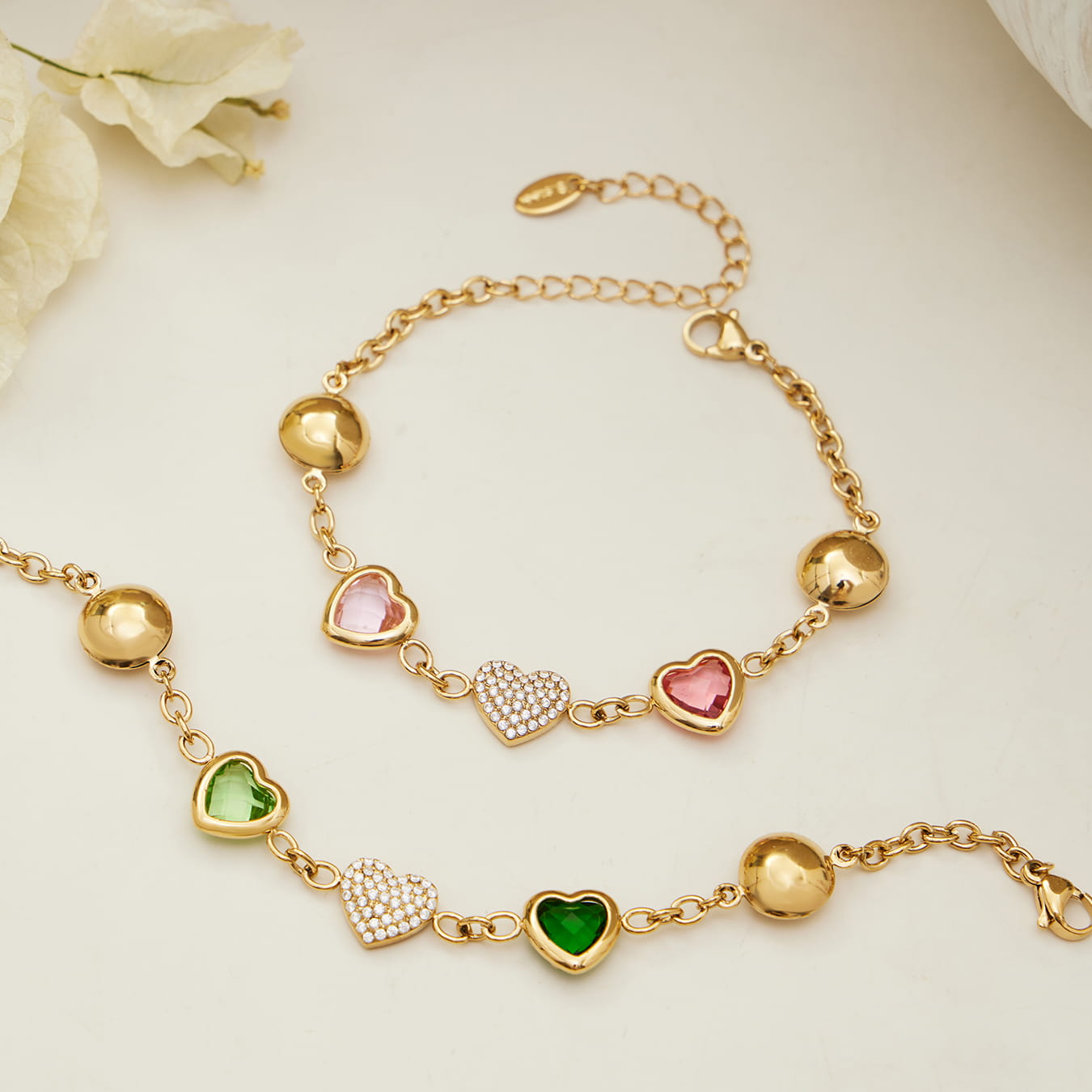 Gold tone heart glass stone bracelet made of 316L stainless steel close up view