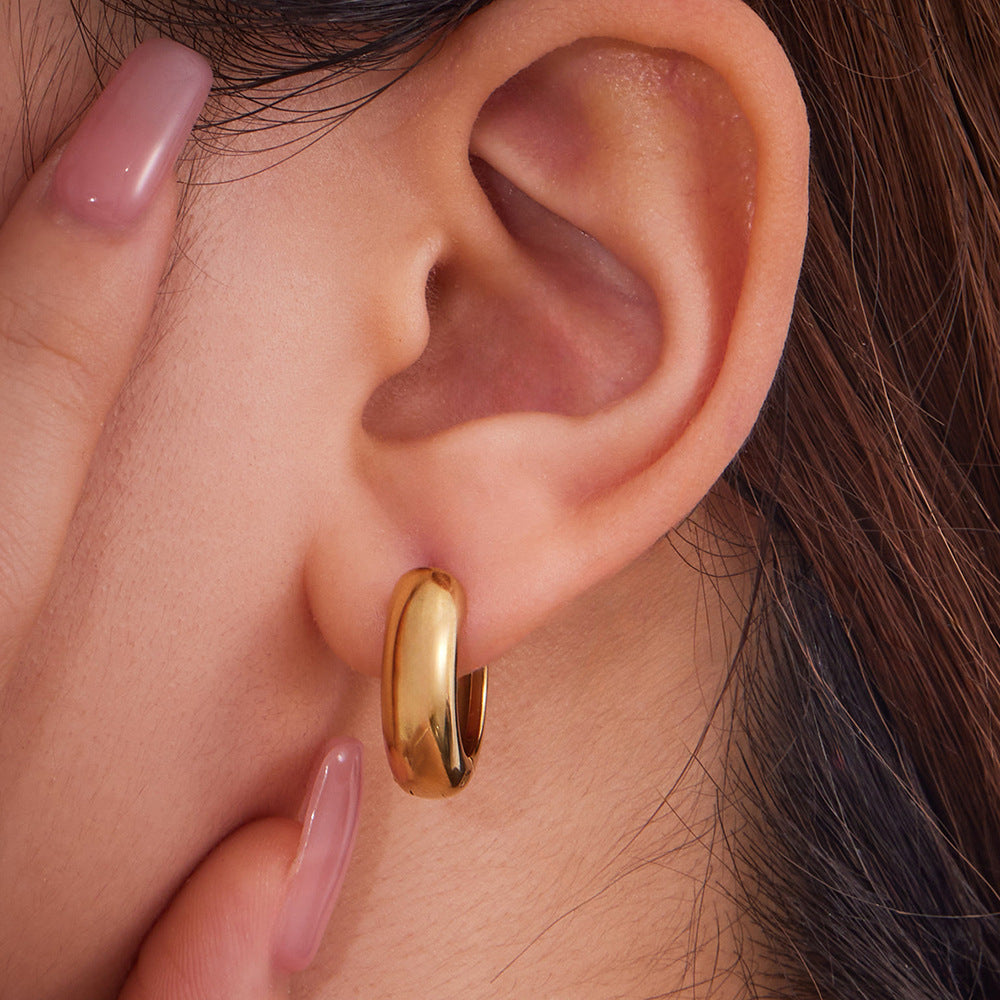 316L stainless steel Mixed Metal Two-Tone Highly Polished Huggie Hoop Earrings close-up detail view for wholesale earrings buyers