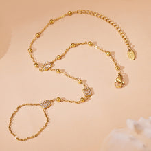 Close-up of 18K PVD gold finish on stainless steel bracelet