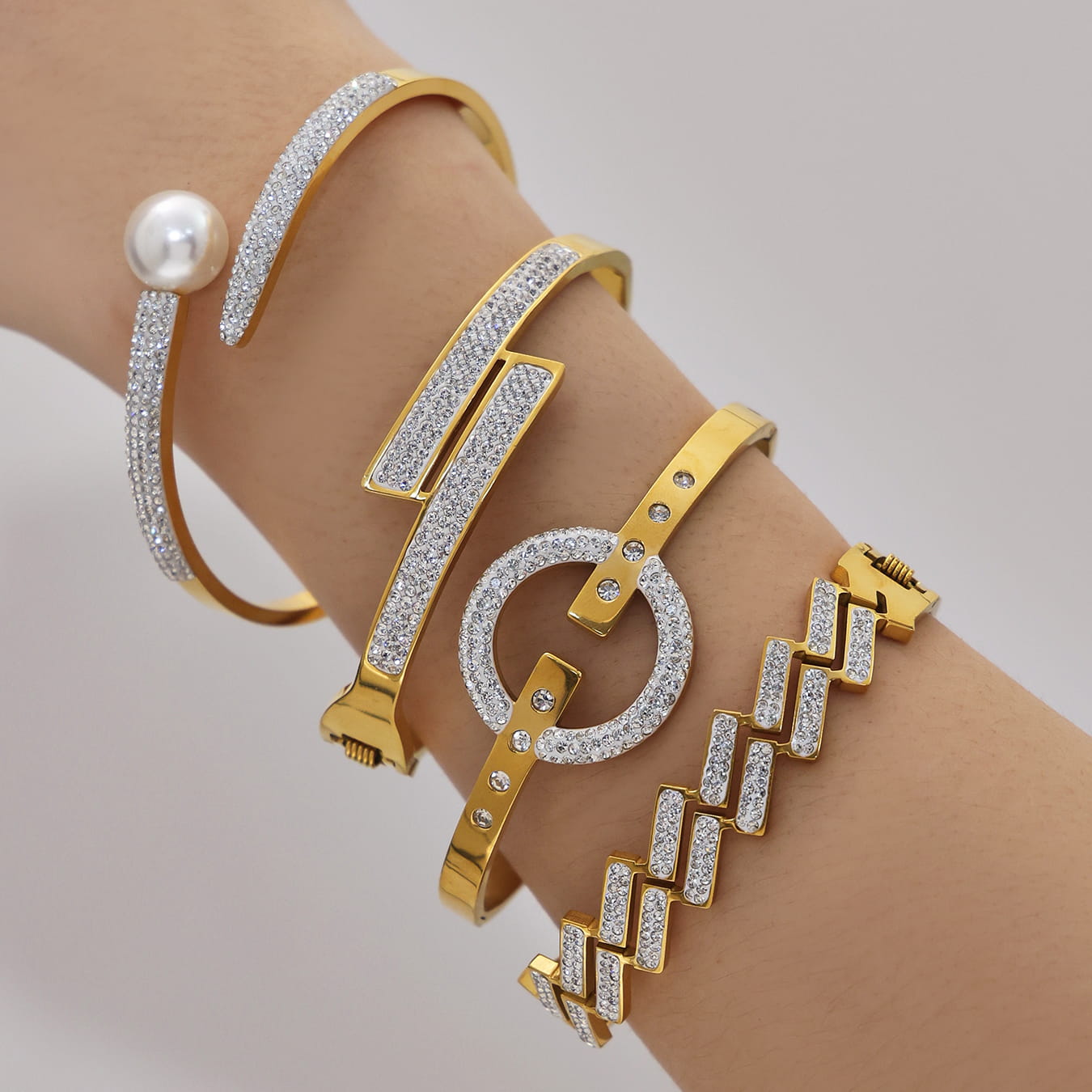 Hinged clasp detail on 316L stainless steel CZ bangle bracelet, 18K PVD gold plated