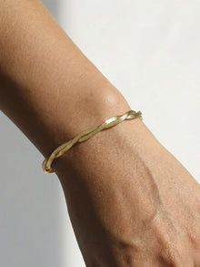 Close-up of 316L Stainless Steel intertwined blade chain bracelet on wrist, waterproof everyday wear