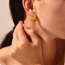 316L stainless steel Minimalist Intertwined Circle Stud Earrings flat lay display for wholesale earrings buyers