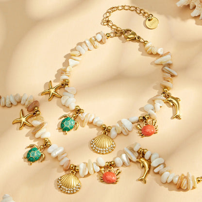 Elegant starfish and turtle pendant on a stainless steel bracelet