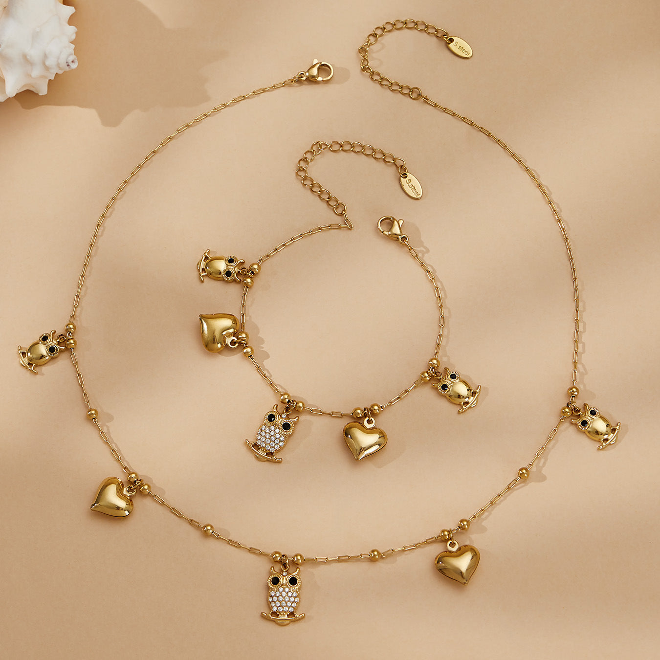 Luxury 316L stainless steel owl and heart charm jewelry set styled for everyday wear