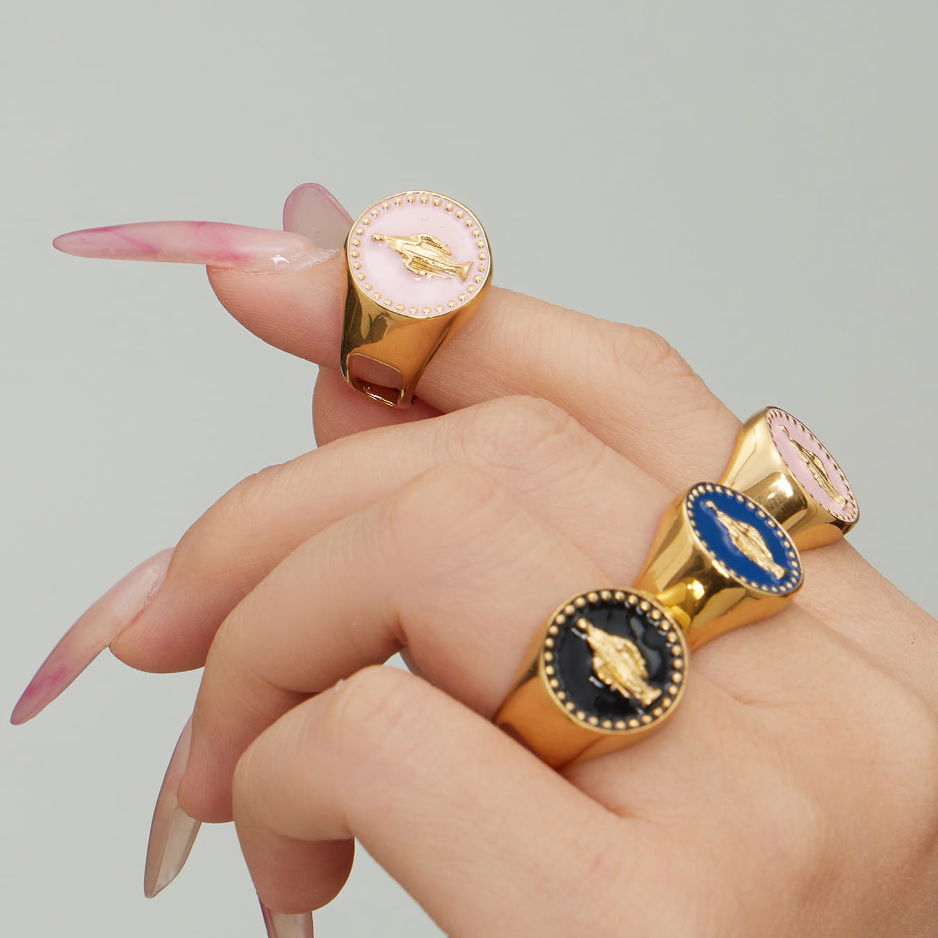 Close-up of 316L stainless steel enamel signet ring with raised geometric detail