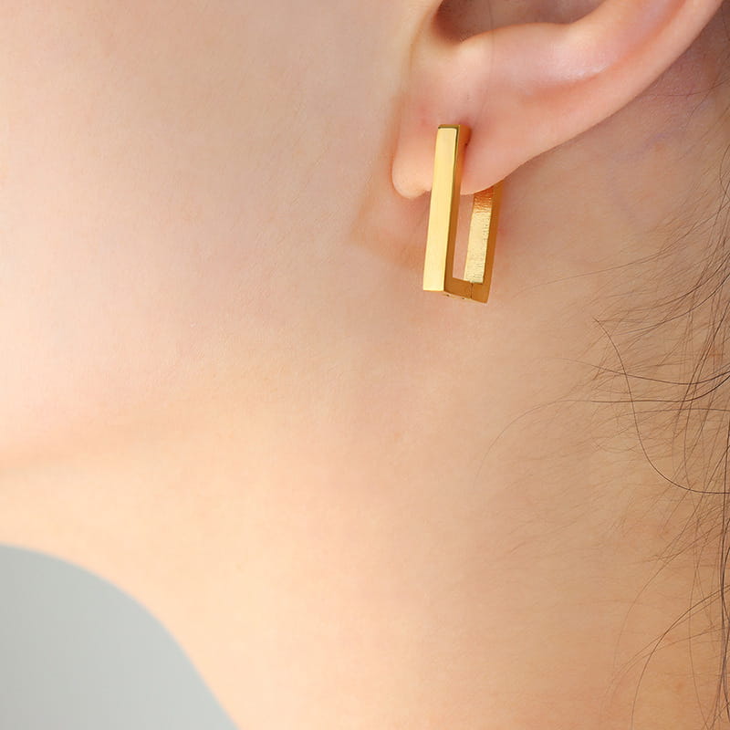 316L stainless steel rectangular huggie hoop earrings worn by model everyday minimalist jewelry