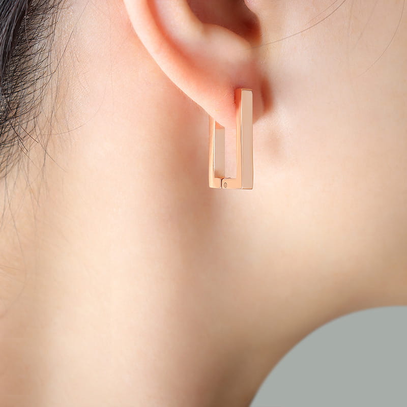 316L stainless steel rectangular huggie hoop earrings rose gold tone on ear