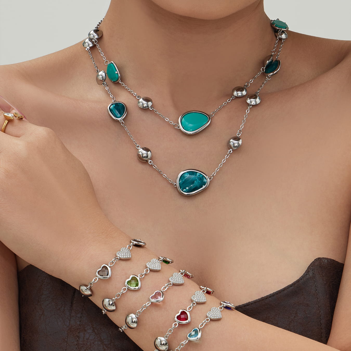 316L stainless steel resin stone necklace paired with glass heart charm bracelets stacked for wholesale display