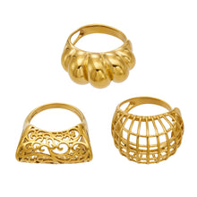 Gold tone 316L stainless steel statement rings in sculptural hollow and geometric cage designs
