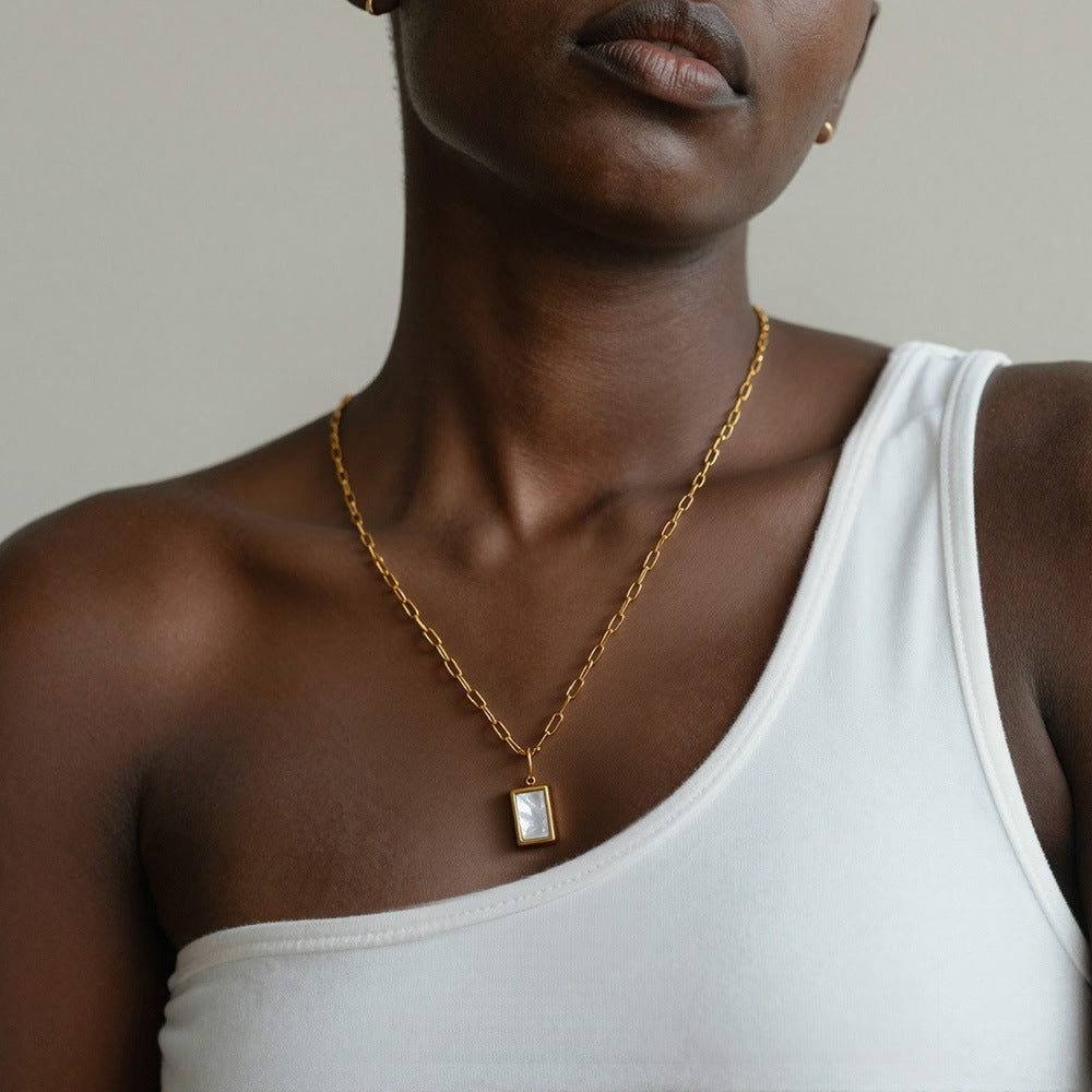 18K PVD gold 316L stainless steel seashell rectangle pendant necklace worn on model