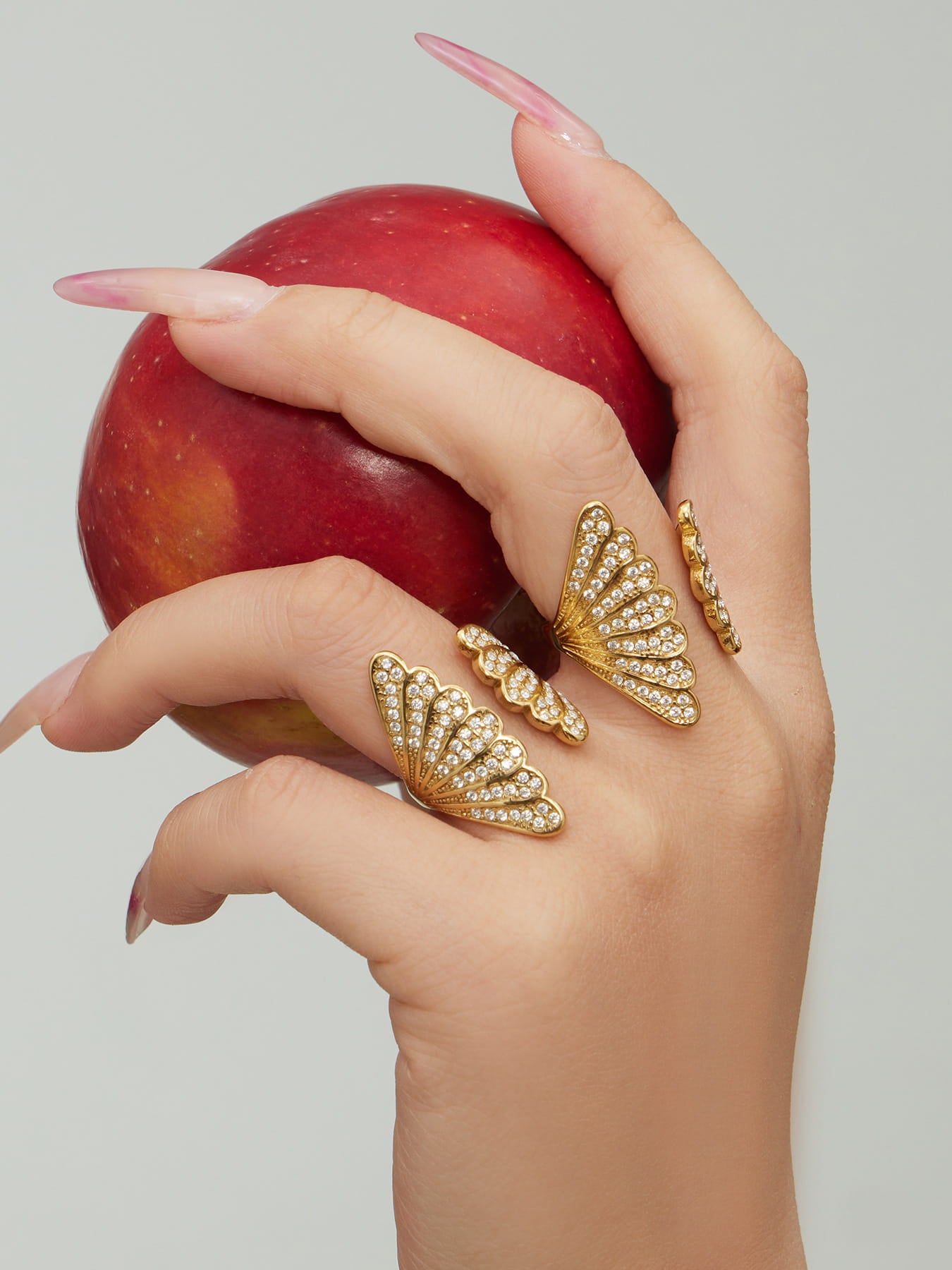 Model wearing 316L stainless steel shell zircon open ring with 18K PVD gold plating