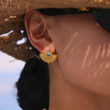Turquoise peacock fan stud earrings modeled for boutique jewelry wholesale