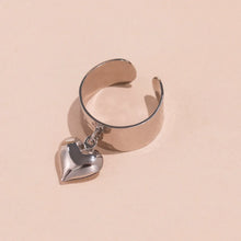 The silver-tone 316L stainless steel hypoallergenic wide band open heart ring designed for sensitive skin.