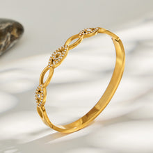 Heart zircon bangle in gold finish