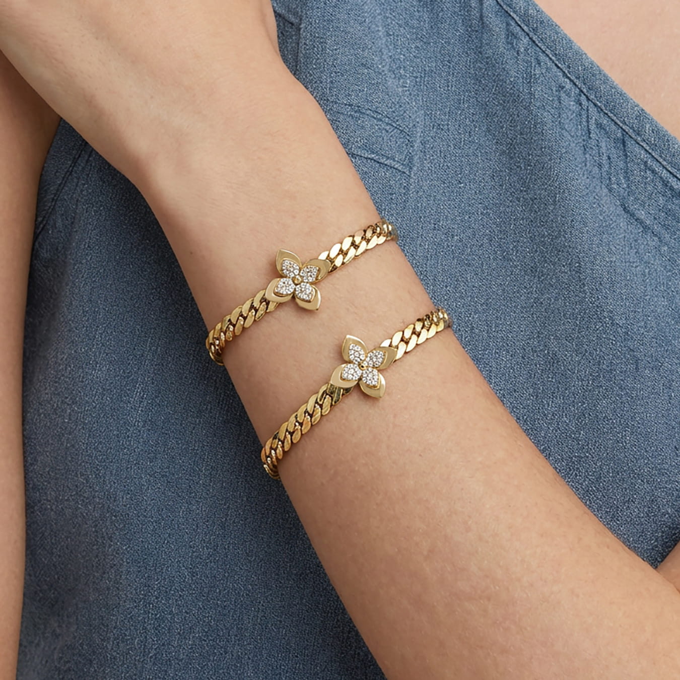 Model wearing 316L stainless steel zircon flower bracelet with 18K PVD gold plating