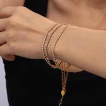 316L Stainless Steel zircon pave bracelet stacked with other waterproof jewelry, 18K gold PVD plating, tarnish-resistant