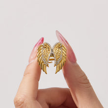 Close-up of zircon wing ring made of 316L stainless steel with gold pvd plating