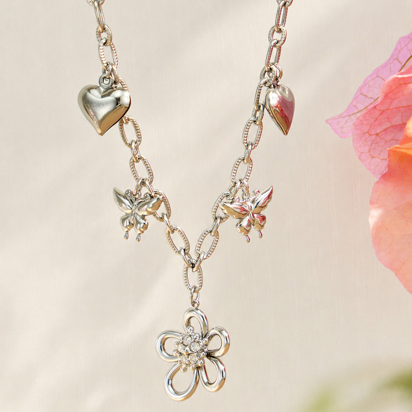 Polished steel floral butterfly charm necklace in 316L stainless steel with zircon details
