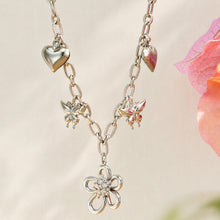 Polished steel floral butterfly charm necklace in 316L stainless steel with zircon details