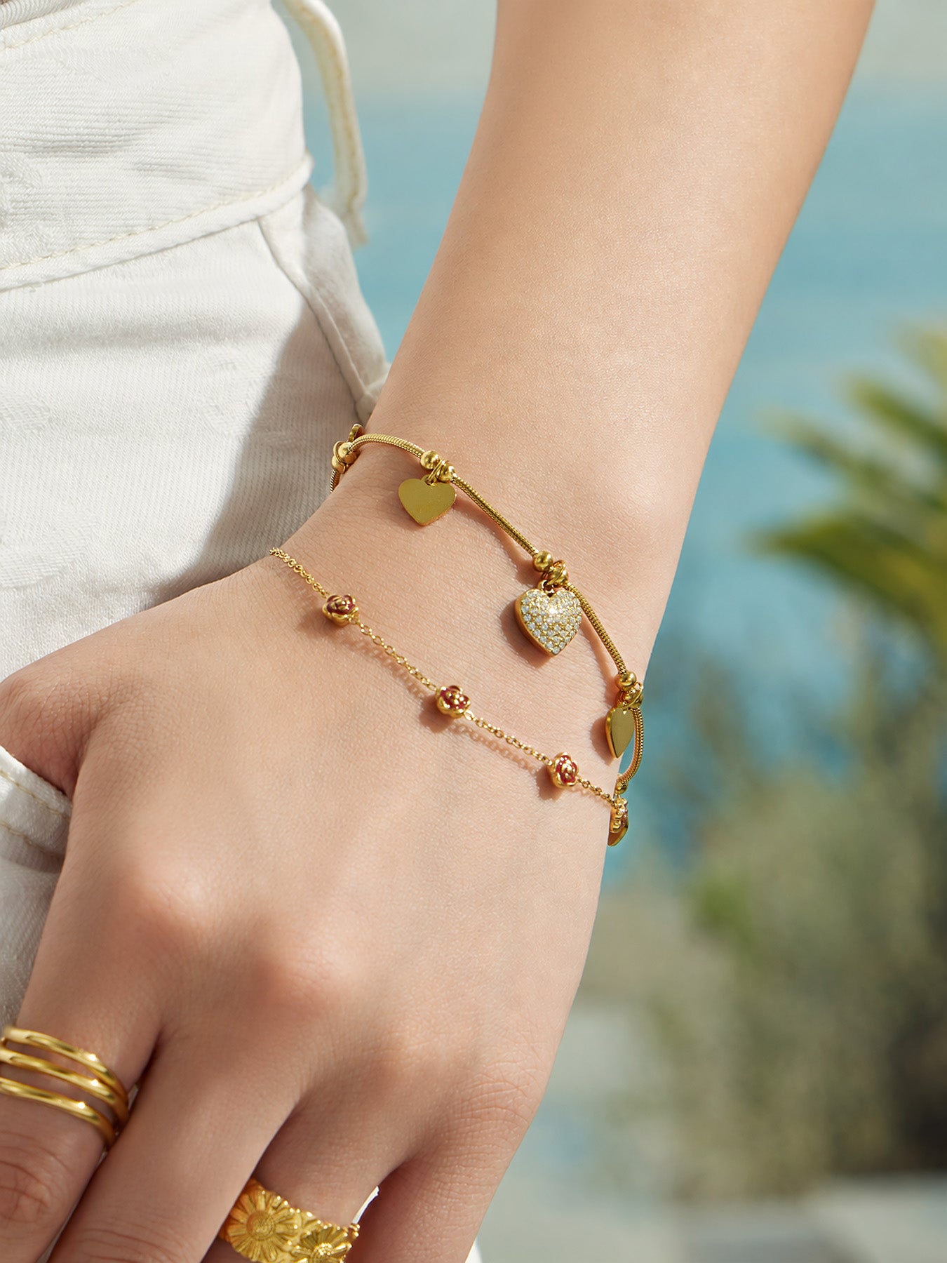 Detail view of 18K PVD gold heart bracelet with zircon stones