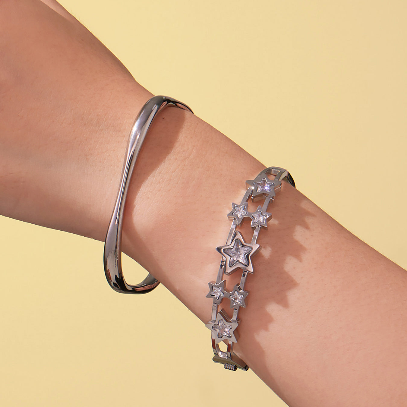 Silver stainless steel 5A zircon star hollow out bangle set on wrist, minimalist fashion style