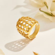 Angled side view of the A195 gold-tone stainless steel lattice ring showing its domed face and band