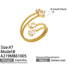 Size guide for the A219 gold-tone stainless steel square-stone twisted open ring, showing size 7 and accent measurements