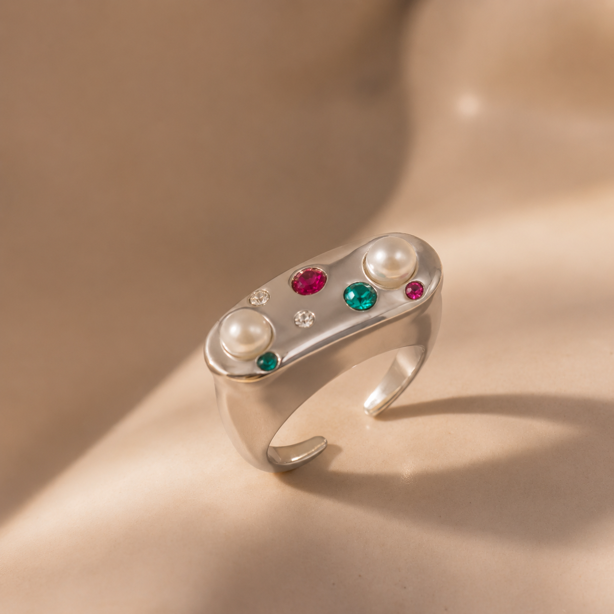 A310 steel pearl rhinestone adjustable open ring with imitation pearls and colorful rhinestones in a soft studio close-up