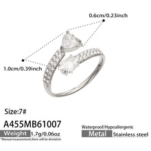 A455 steel-tone stainless steel heart and oval ring size guide showing clear stones, size 7 and accent measurements