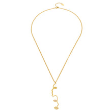 MiduoduoJewelry gold abstract face lariat Y necklace on a clean neutral background