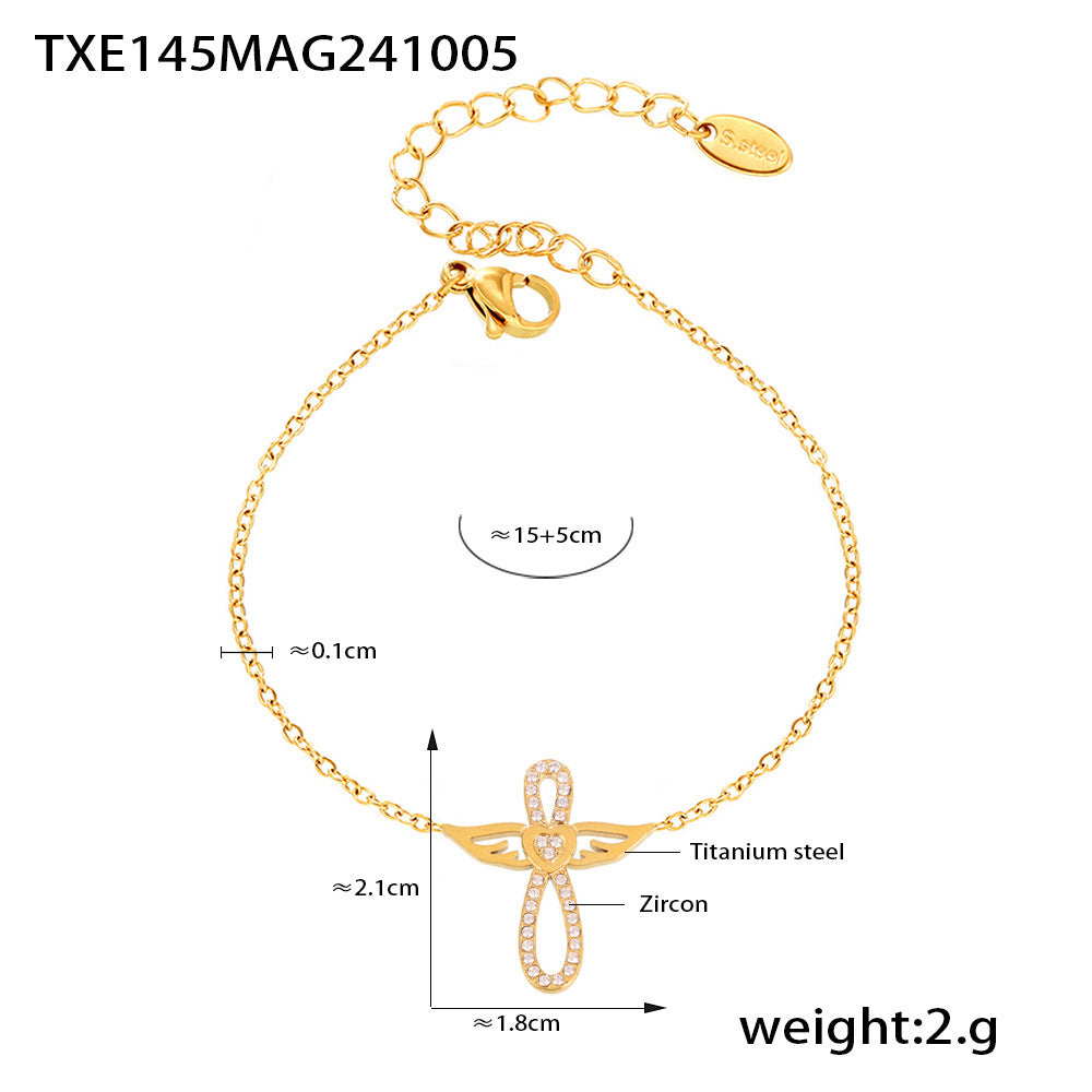 Gold PVD angel wing CZ charm bracelet in stainless steel, 15+5cm extender, waterproof daily wear.