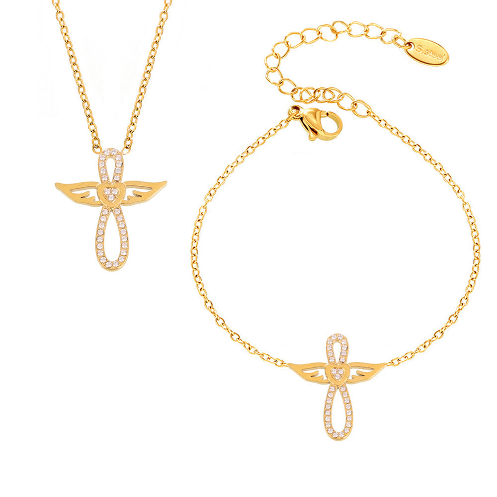Gold stainless steel angel wing CZ necklace and bracelet set for layering, wholesale boutique jewelry.