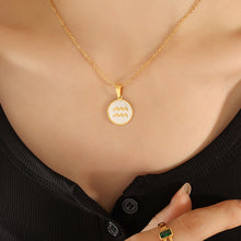 Aquarius zodiac sign necklace worn by woman