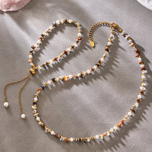 Detailed flat lay of coordinating natural stone necklace and bracelet designs