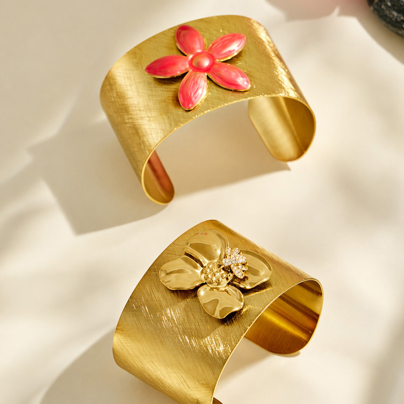 Bee zircon and pink enamel flower cuff bracelet design options displayed together