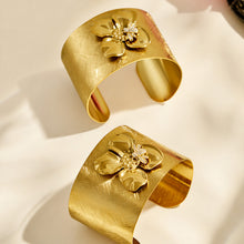 Front and angled views of a gold bee flower cuff bracelet with zircon details