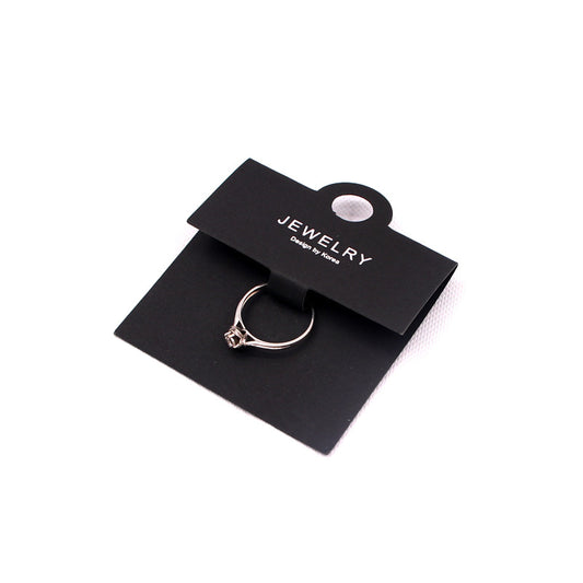 Black ring display card with a ring mounted for jewelry packaging and retail presentation