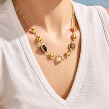Black glass stone necklace worn on model