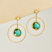 Blue glass stone drop earrings with textured circular gold-tone frame