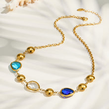 Blue glass stone necklace flat lay