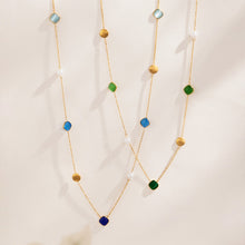 Gold-tone long necklaces with blue, green and warm-tone cat eye effect bead details
