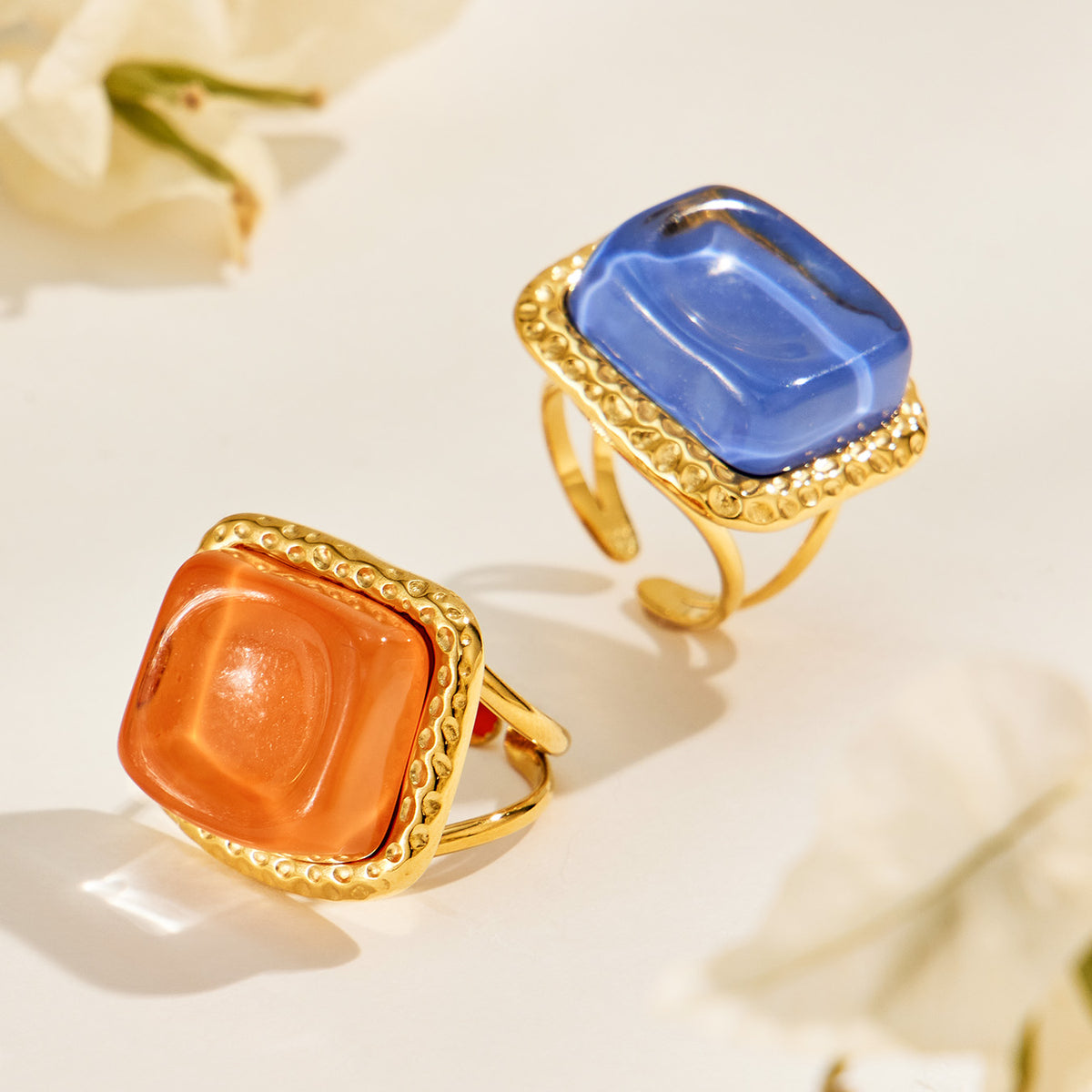 Blue and orange resin statement rings with sculptural square tops