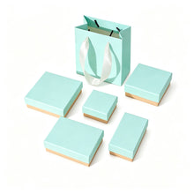 Blue and pink jewelry boxes with foam inserts and matching gift bag for wholesale jewelry packaging