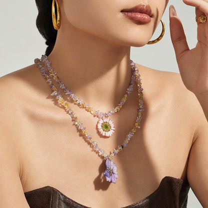 Botanical resin flower crystal necklace styled on model for boutique, resort and gift jewelry displays