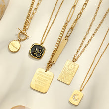 Close-up assortment of celestial, medallion and geometric pendant necklaces