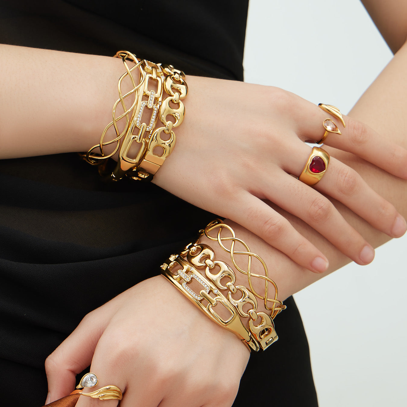 model front view wearing 18k gold chain weave zircon open bangle set, stacked with rings for daily styling