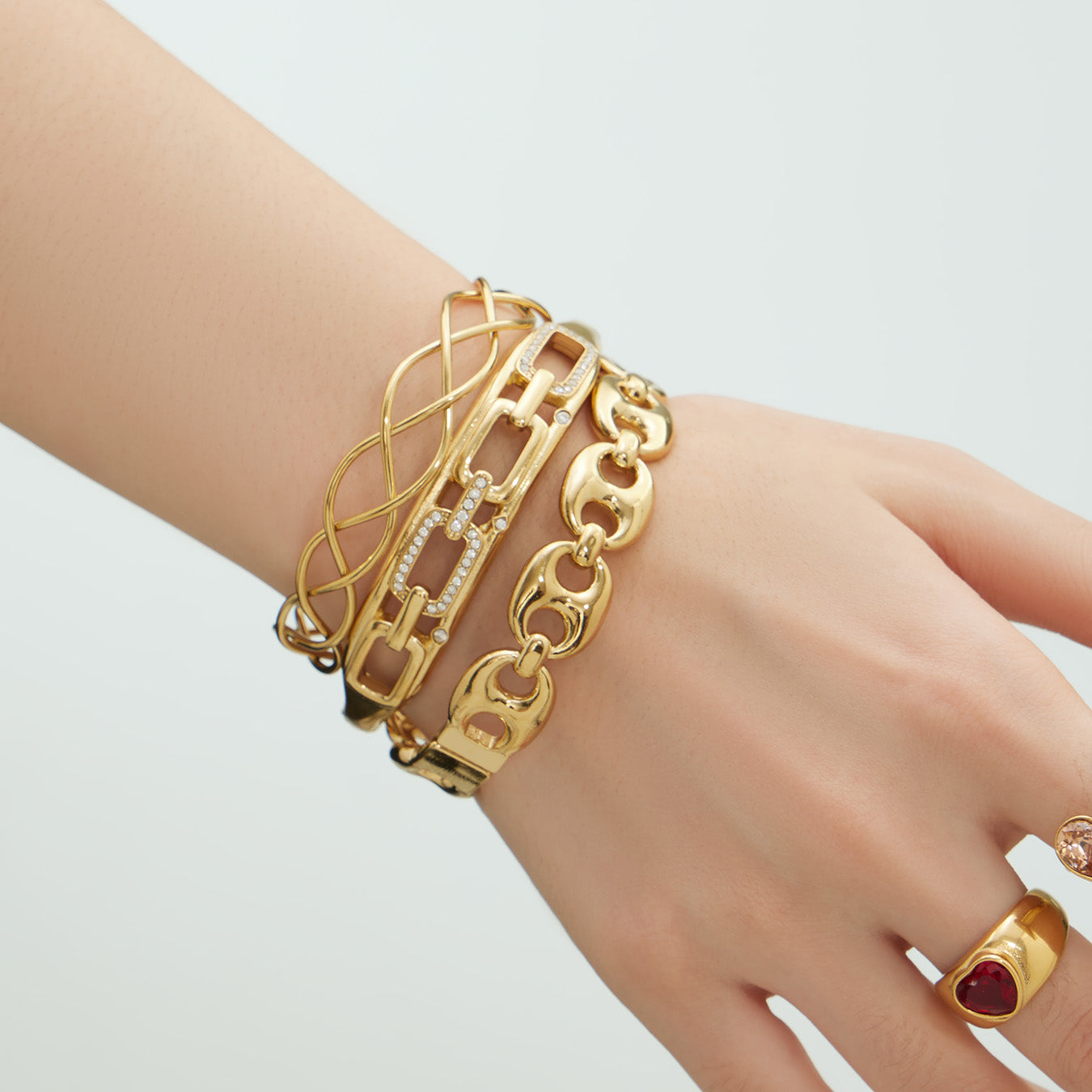side view of 18k gold chain weave zircon open bangle set on wrist, minimalist stackable stainless steel jewelry