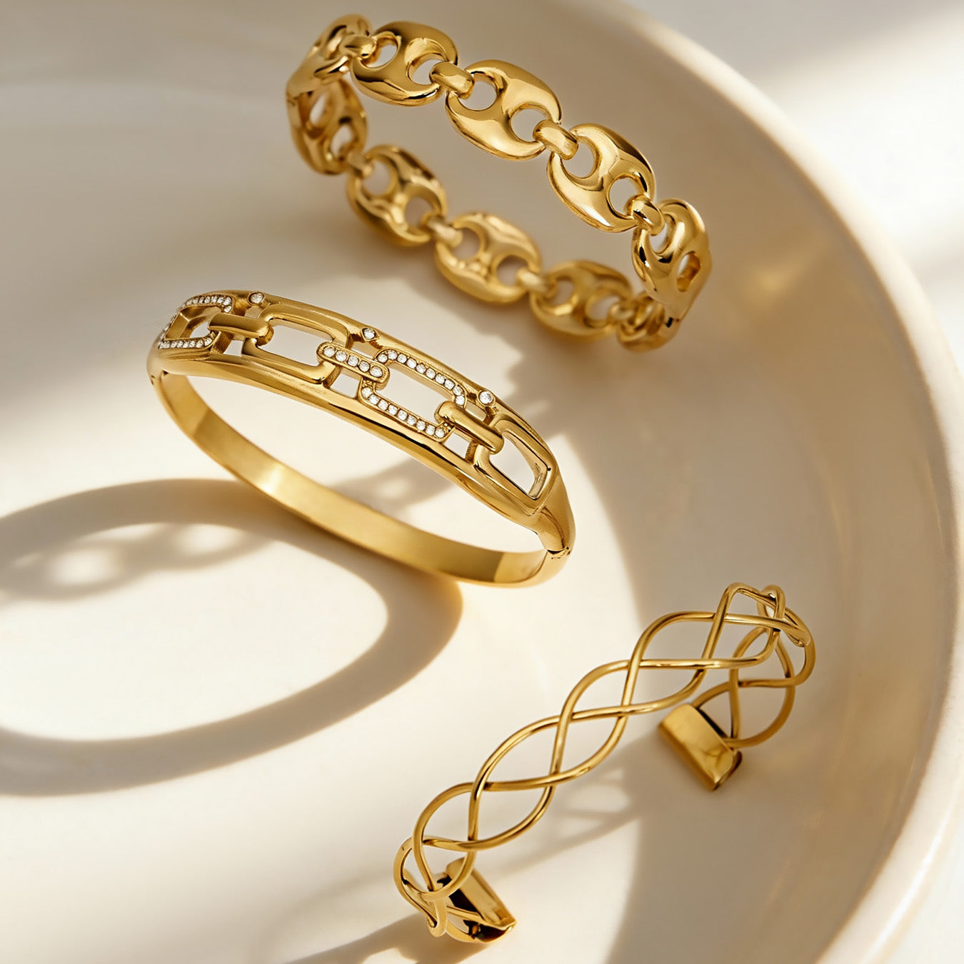 18k gold chain weave zircon open bangle set on white plate, modern minimalist stackable bracelets