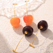 Orange-red, bright red, burgundy and deep red cherry drop earrings displayed together
